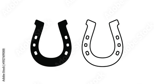 Two contrasting horse shoes one black one white facing each other