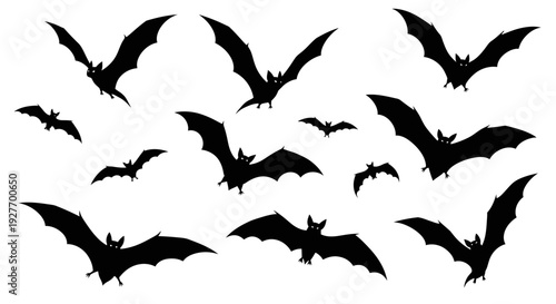 A collection of black bat silhouettes flying against a white background, creating a spooky Halloween atmosphere.