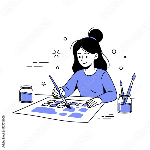 Young asian female artist painting with brushes and ink