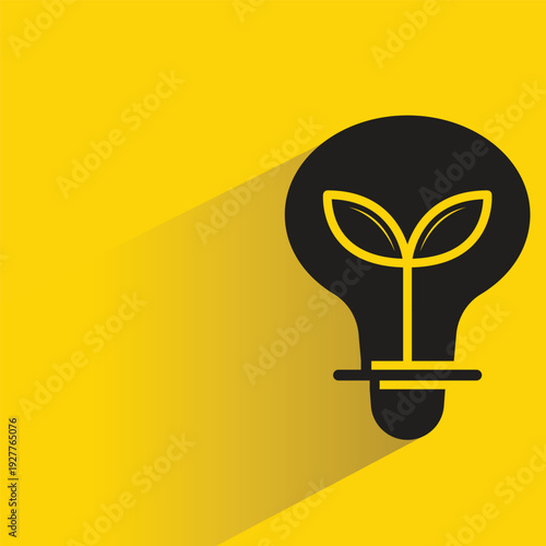 leaf in light bulb icon with shadow on yellow background