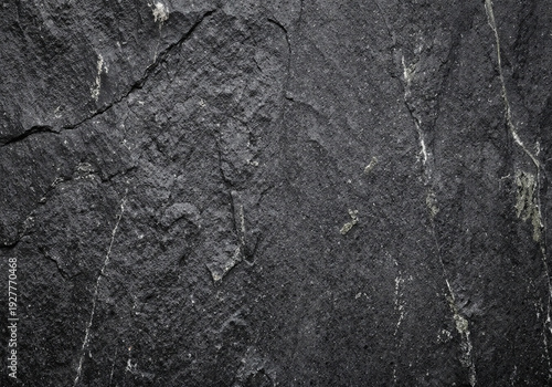 Dark Textured Gradient Background, Black Charcoal Gray Tones, Subtle Highlights, Cracked Veined Stone Forms, Rough Grainy Surface, Versatile Design Overlay