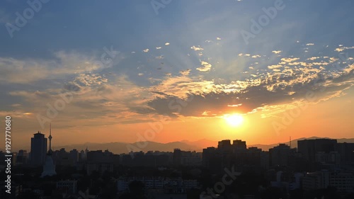Stunning city timelapse footage capturing the transition from sunrise to sunset, with golden hour light, dramatic clouds, and city lights illuminating the urban skyline in 4K.
