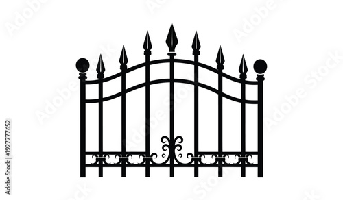 Black metal gate with pointed tops and decorative scrollwork