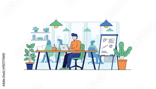 Man working on laptop at modern office desk with coworkers