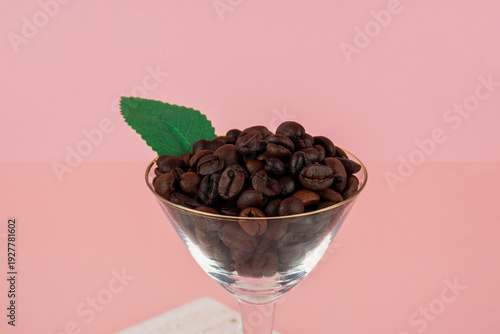 Wallpaper Mural Coffee beans in a wine glass and photo props with a pink backdrop. Torontodigital.ca