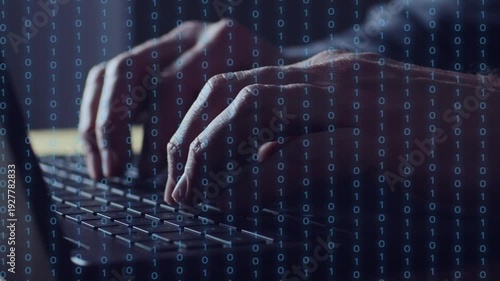 Business man hand typing on a computer. Close up. Binary numbers moving across the screen. Business strategy for success. Working hard. Digital content creation.