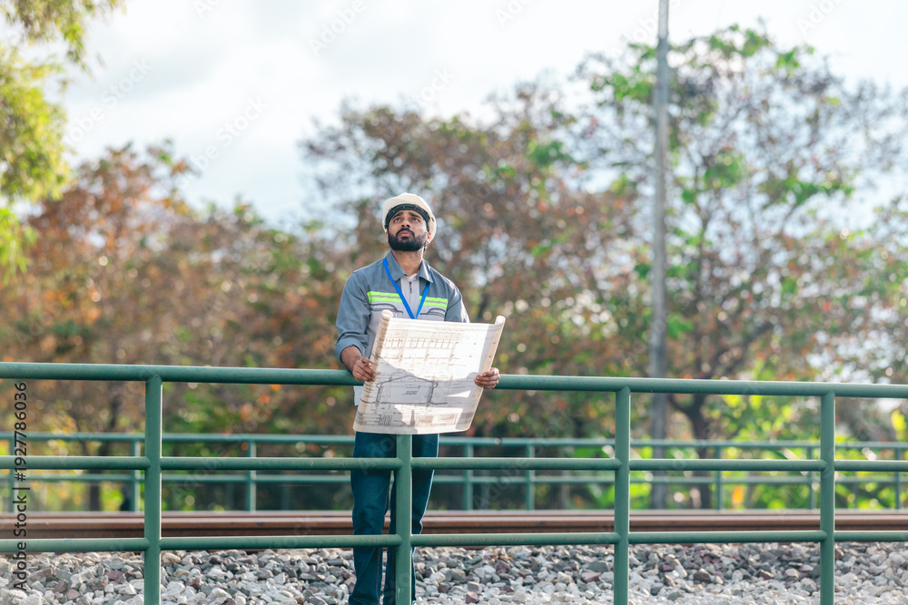 Fototapeta premium Engineer Presenting Railway Expansion Plan to Investor