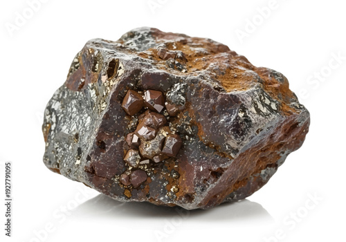 A rough, metallic ore specimen displayed on a plain surface, showcasing its textured, rusty appearance from a frontal viewpoint.