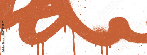 Orange graffiti spray paint drips on a white background.