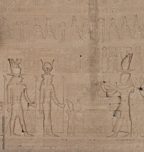 Wallpaper Mural Ancient Egyptian stone carvings depicting figures and symbols on temple wall Torontodigital.ca