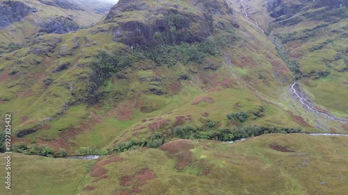 Awesome drone video filming the three sisters of Glencoe and its valley, Scotland, during a lovely fall day.