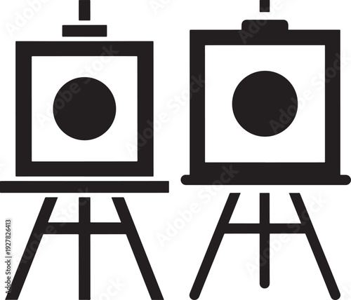 Two simple black easels holding square canvases with a black circle, representing art creation, painting, and creative expression.
