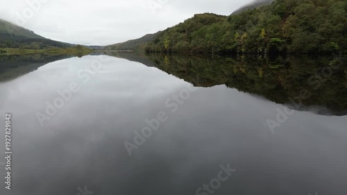 Amazing drone video over Loch Lugnaig, near Ardchullarie More, Scotland, taken during a lovely autumn day while roadtripping along Scottish countryside.