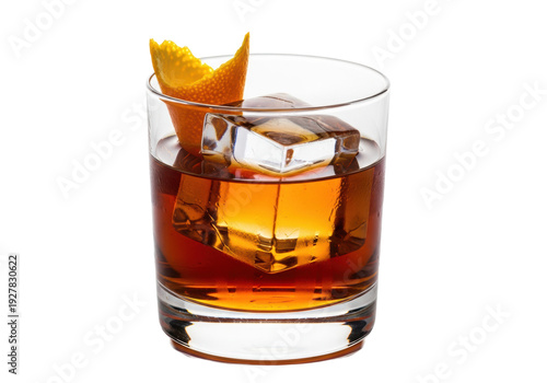 An old fashioned cocktail with a large clear ice cube and orange peel garnish in a rocks glass isolated on a white background. Concept for luxury beverage advertising.