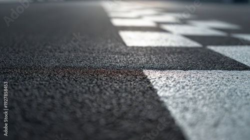 The Finish Line on Asphalt Racing Track with Closeup Texture and Shallow Depth