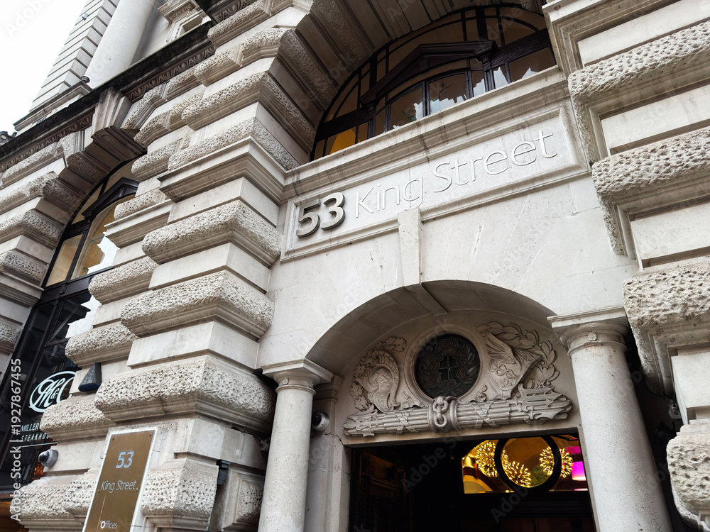 Obraz premium Exterior view of 53 King Street Offices in Manchester UK, ornate stone facade and grand arched entrance