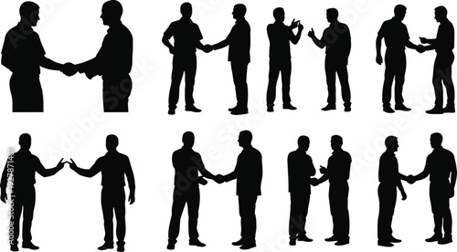 Silhouettes of business people shaking hands show partnership.