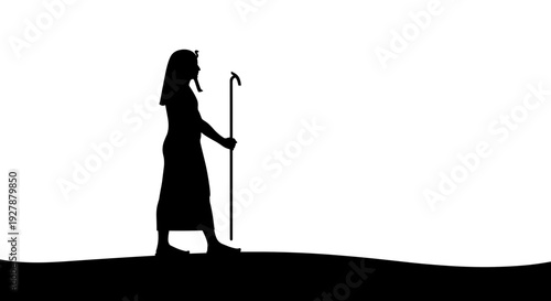 Silhouette of Shepherd with Staff Walking.