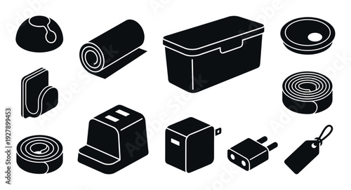 Set of black isometric vector icons showing various household and travel items like a charger, plug, box, and rolled mat in a minimalist graphic design style