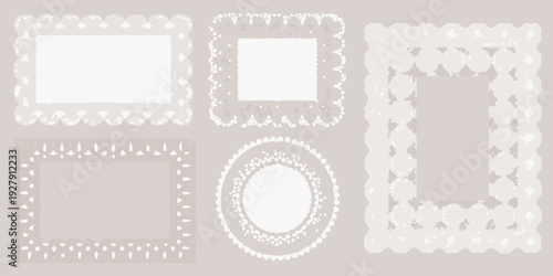 Various white lace frame designs isolated on a neutral grey background displayed in a collection