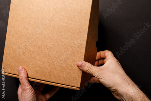 Close-up of hands holding a...