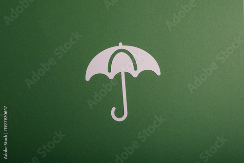 Paper umbrella on green.  C...