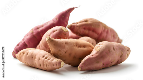 A pile of sweet potatoes on a white background