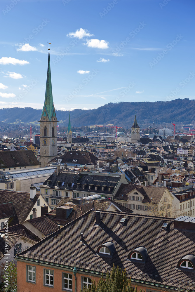 Obraz premium Zurich Skyline with Historic Church Towers and Alpine Backdrop