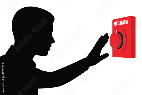 Silhouette of a person activating a bright red fire alarm system