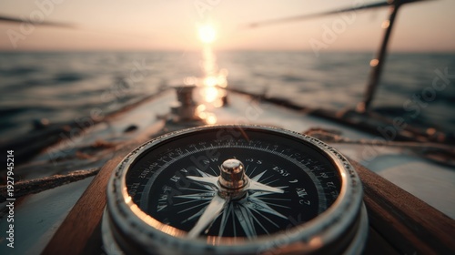 Close-up of a Nautical Compass at Sunset on a Sailboat with Glimmering Ocean Waves in the Background