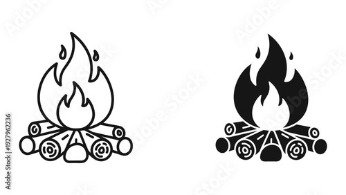 Campfire flames burning brightly on wooden logs outdoors