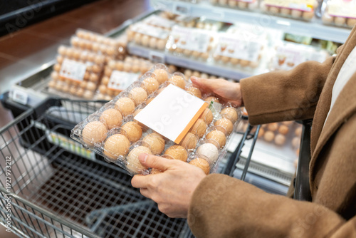 Wallpaper Mural Woman Holding Egg Carton in Supermarket Torontodigital.ca