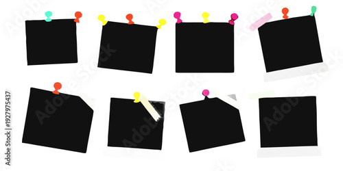 Several black sticky notes pinned to a dark background with colorful tacks