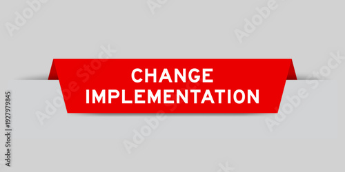 Red color inserted label with word change implementation on gray background