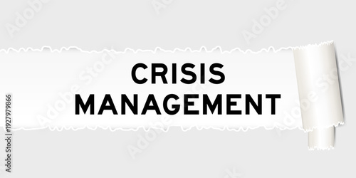 Ripped gray paper background that have word crisis management under torn part