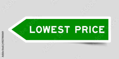 Green color arrow shape sticker label with word lowest price on gray background