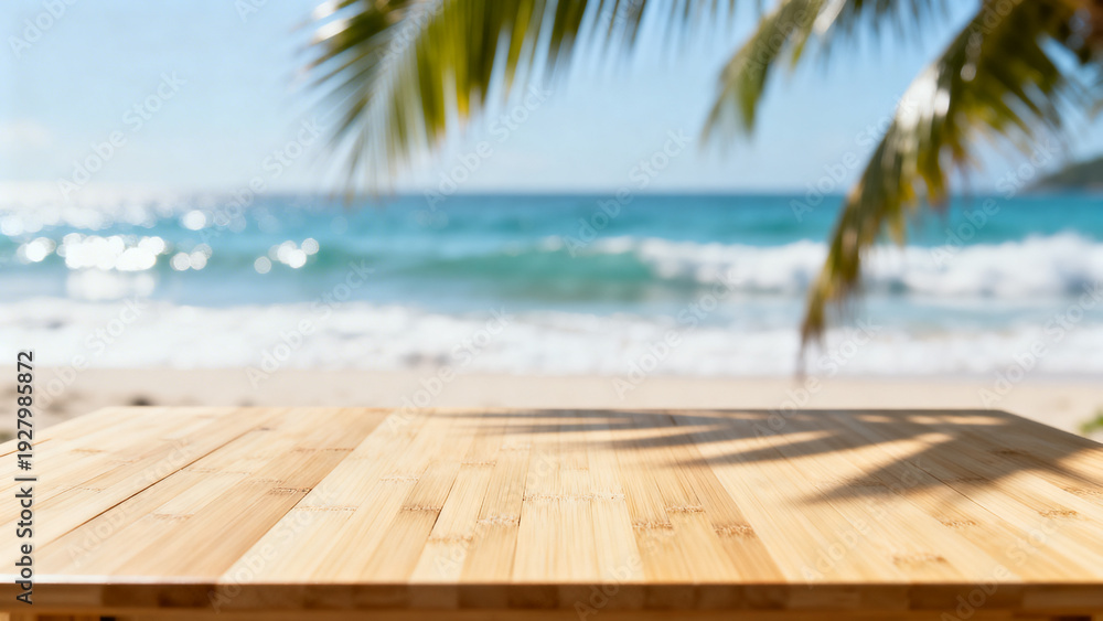 Fototapeta premium Empty wooden table on a blurred tropical beach background with shimmering sea and palm shadows