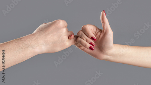 Slika na platnu Two people clapping their pinkies together