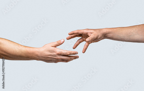 Closeup help hand. Two hands, helping arm of a friend, teamwork. Helping hand. Helping hand outstretched, isolated arm, salvation