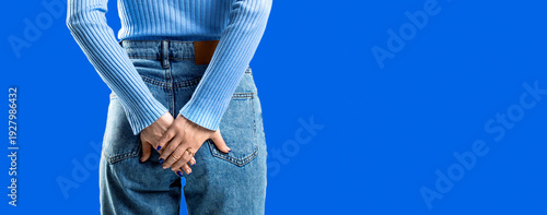 Hemorrhoids. . Woman suffering from hemorrhoids, anal pain. Woman hand holding her bottom because having Abdominal pain and Hemorrhoids