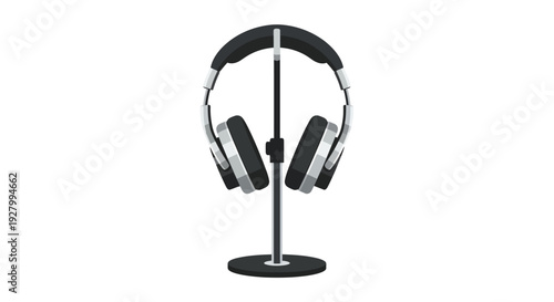 Black and silver headphones on a stand against a white background.