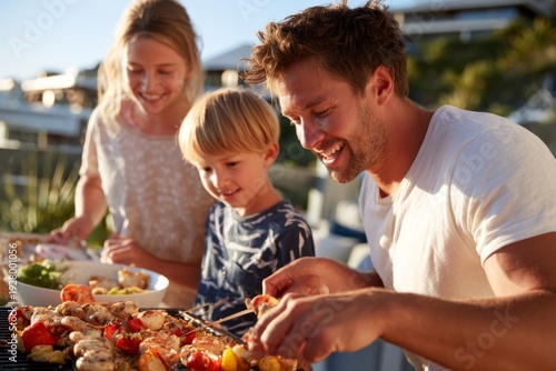 Joyful Summer Gathering on Patio with Family Grilling Seafood Together in Warm Sunshine