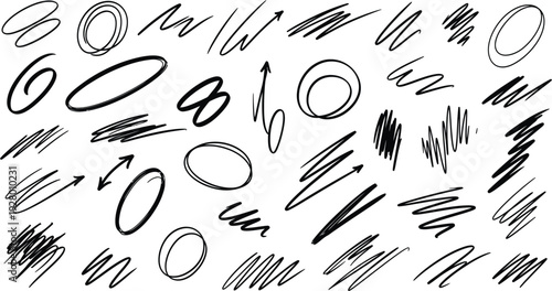 Collection of various abstract shapes and strokes in black on a plain surface from a direct viewpoint