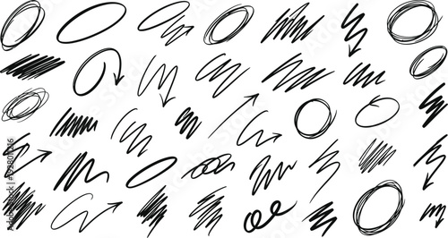 Abstract hand drawn symbols and shapes scattered across a plain background from a direct viewpoint