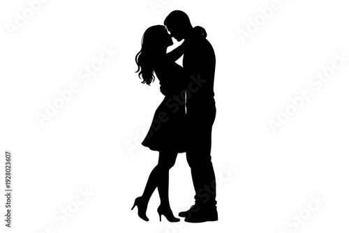Silhouette of romantic young caucasian couple embracing and kissing.
