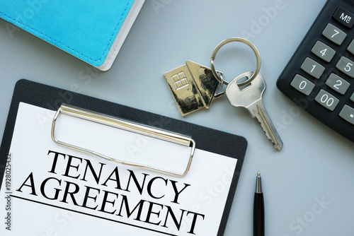 Photos Tenancy agreement document for rental property, lease contract signing concept,
