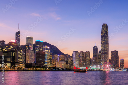 Canvas Print Hong Kong city skyline at sunset with glowing sky and skyscrapers