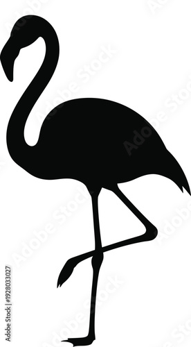 A striking silhouette of a flamingo standing with elegant poise