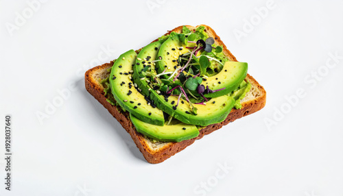 Avocado toast with microgreens and black sesame seeds on whole wheat bread