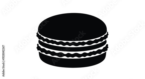 A simple black silhouette of a layered macaron dessert